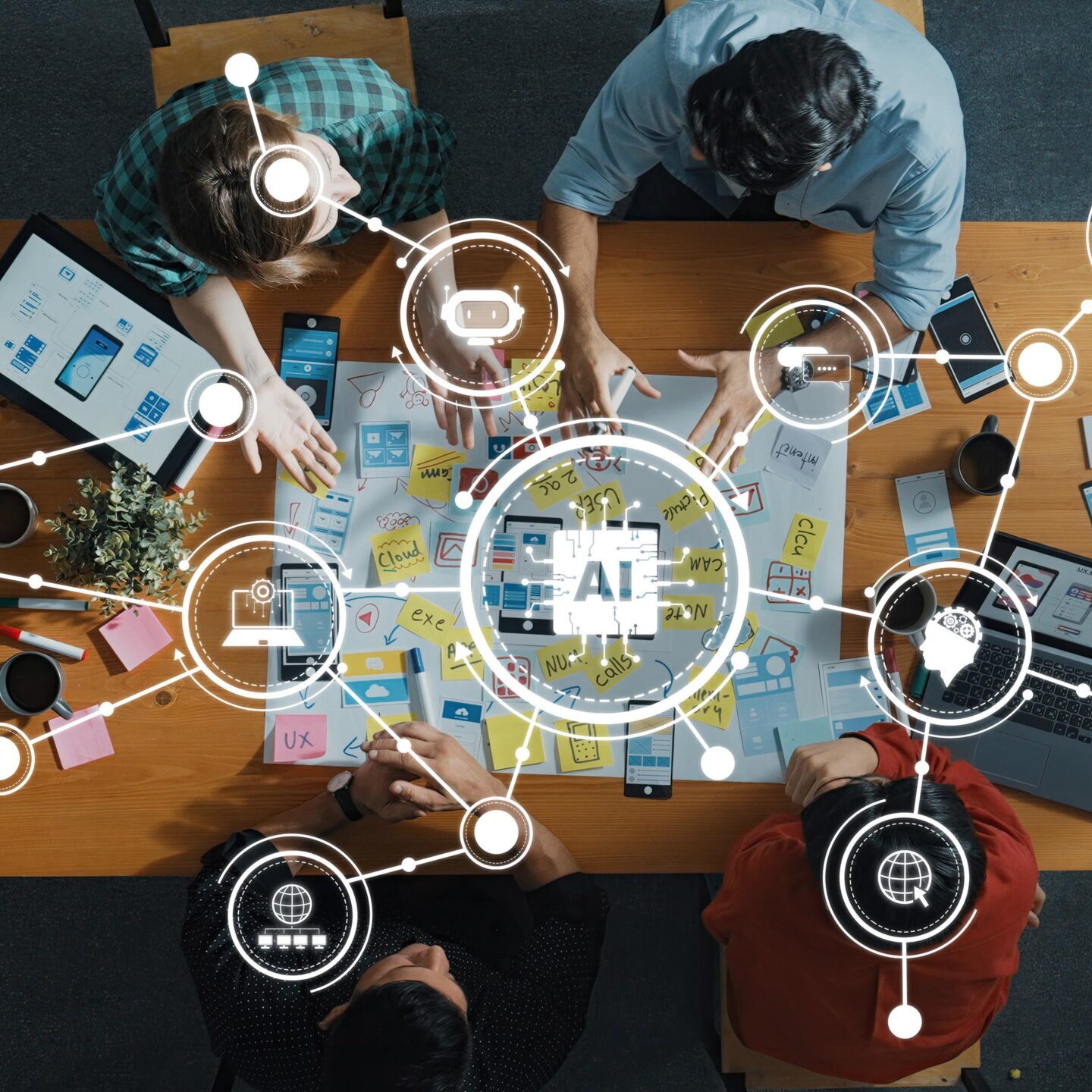 A top-down view of a collaborative team working on AI technology development with digital tools on a wooden table, showcasing creativity and innovation in professional settings. Amity
