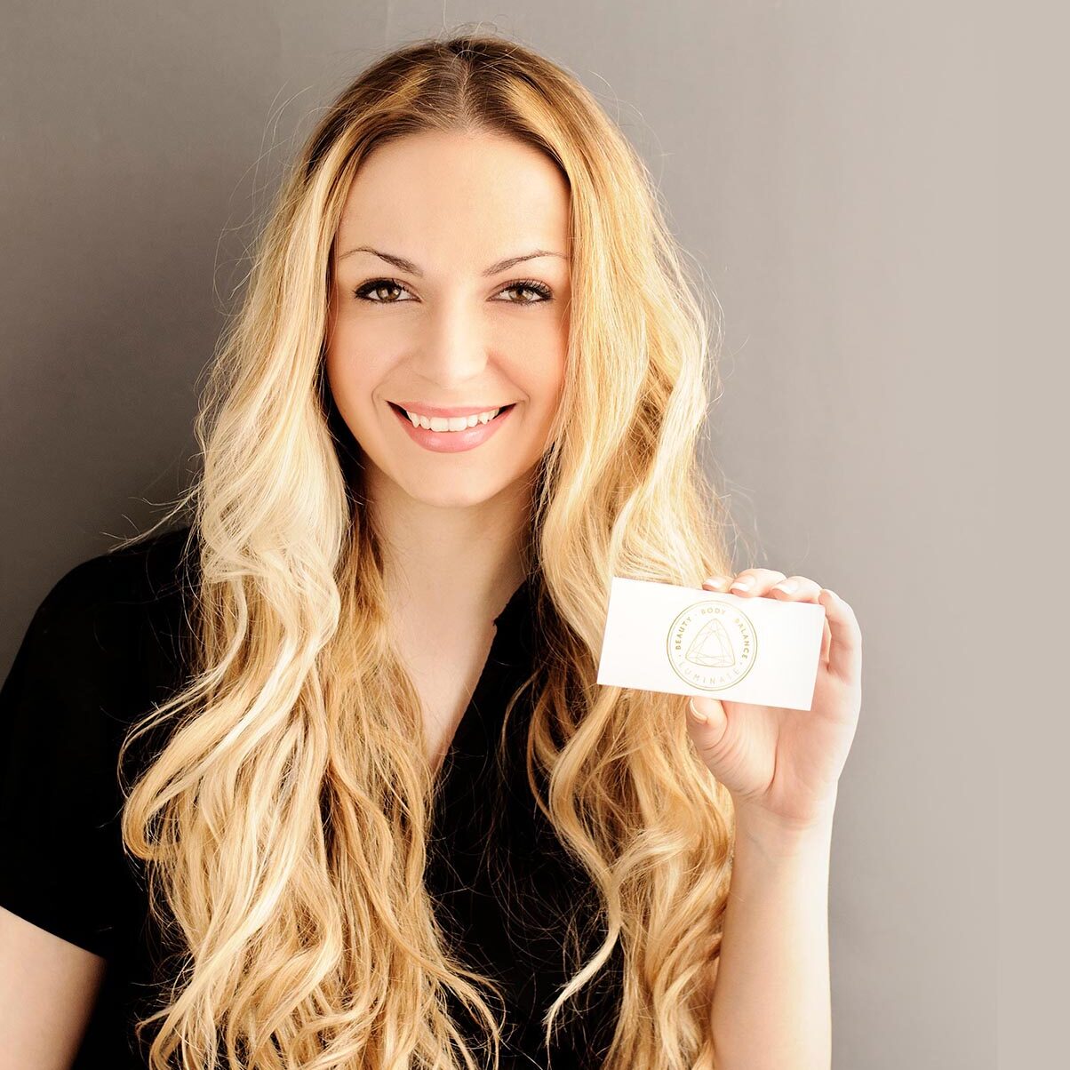 Girl holding blank membership card